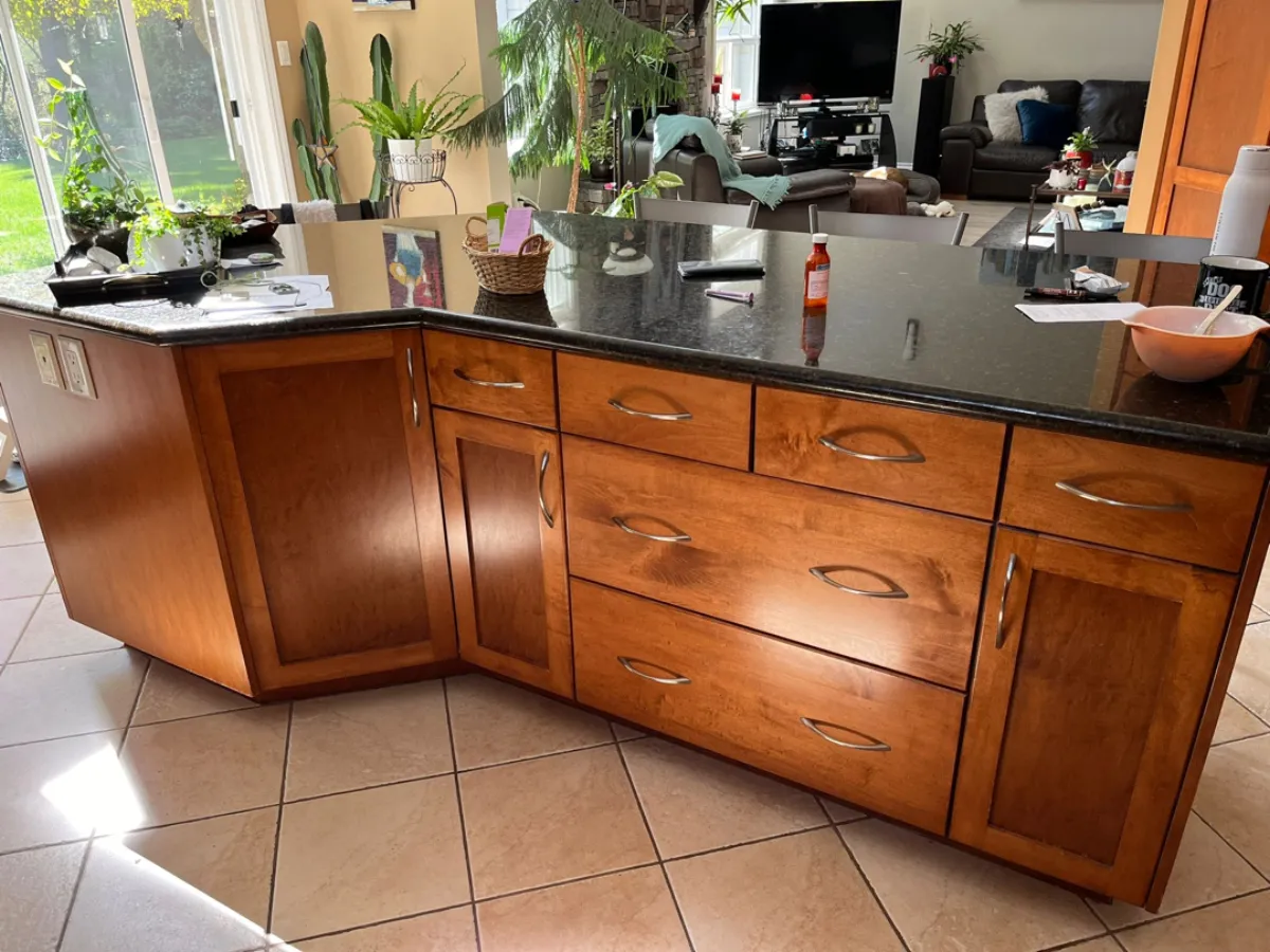 Close-up of Anmore kitchen island cherry wood cabinet drawers before renovation